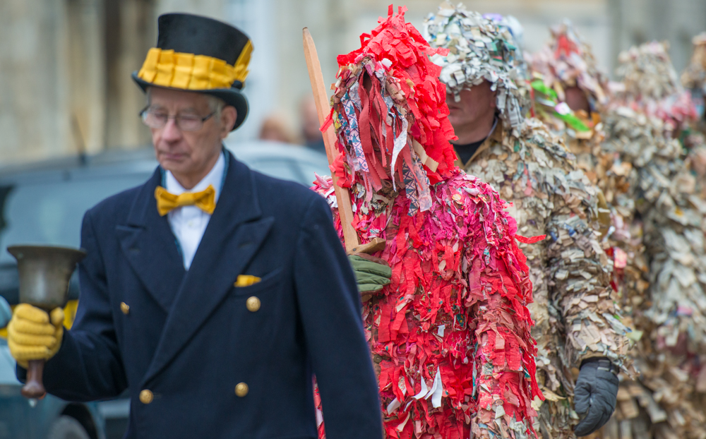 The 'Town' Crier' leads the Marsfield Mummers along the High Street
