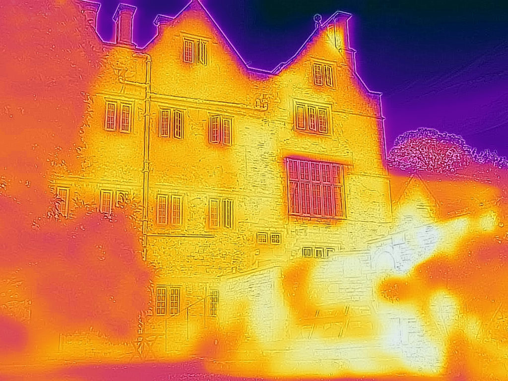 Infrared image of Cheney Court near Bath showing heat from sunlight radiating off stone walls.